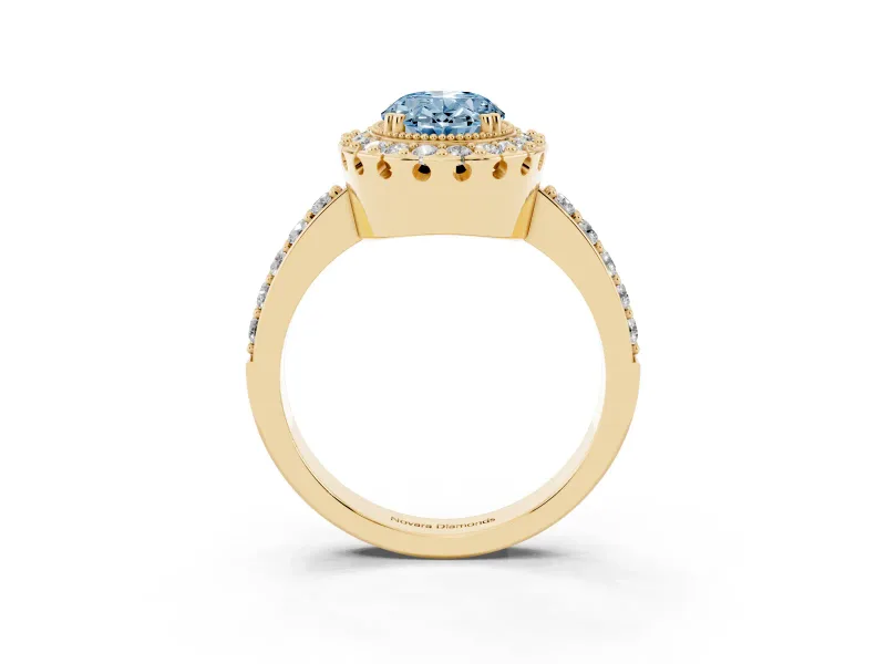 Fancy Blue Oval Cut Diamond Halo Ring Set in Yellow gold with Pavé Shank and Prong Setting