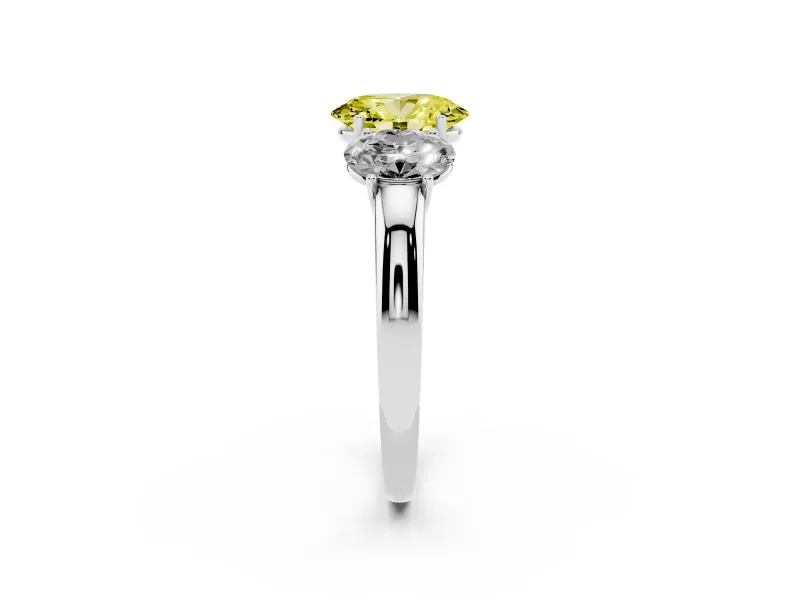 Fancy Yellow Oval Cut Diamond Three-Stone Ring Set in Platinum with Bold Center and Classic Band