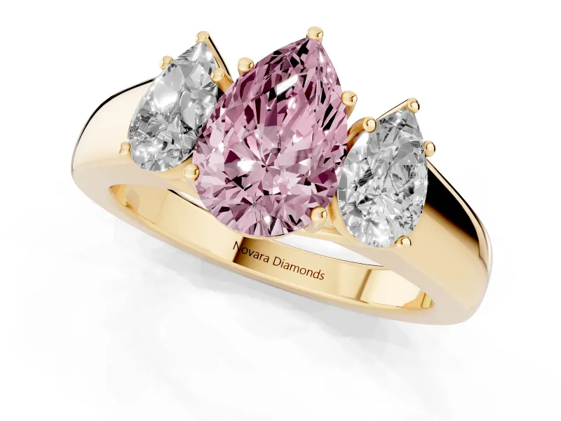 Fancy Pink Three-Stone Pear Cut Diamond Ring Set in Yellow gold with Matching Prong Settings and Plain Band