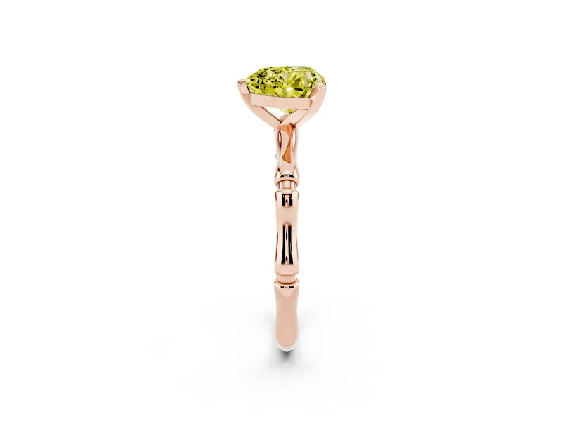 Fancy Yellow Heart Cut Diamond Solitaire Ring Set in Rose gold with Bamboo Band and Prong Setting