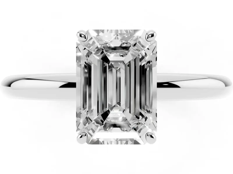 Emerald Cut Diamond Solitaire Ring Set in Platinum with Prong Setting on a Polished Plain Band