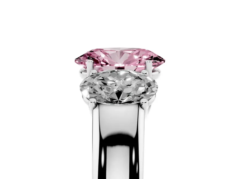 Fancy Pink Three-Stone Oval Cut Diamond Ring Set in Platinum with Matching Prong Settings and Plain Band