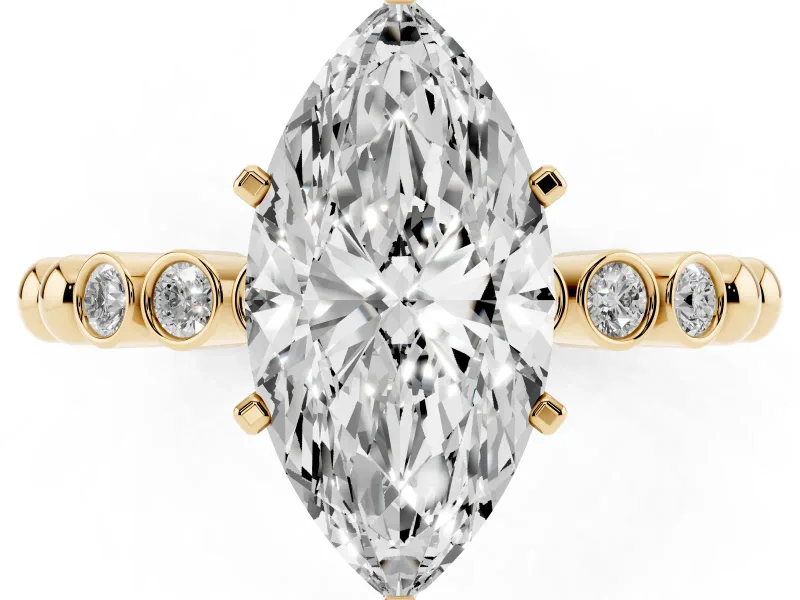 Marquise Cut Diamond Solitaire Engagement Ring Set in Yellow gold with Bezel Accents on Beaded Band