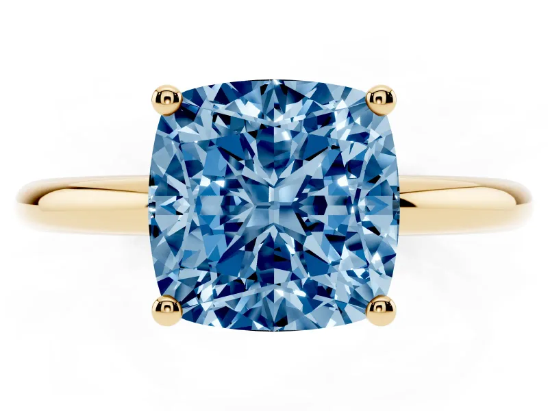 Fancy Blue Cushion Cut Diamond Solitaire Engagement Ring Set in Yellow gold with Prong Setting and Polished Band